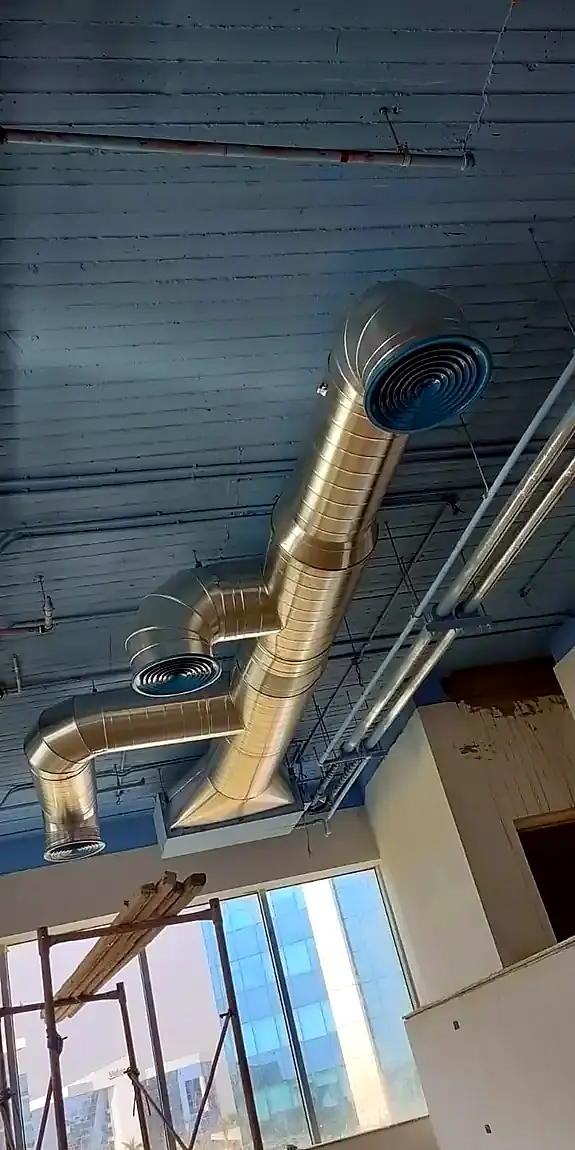 Exposed spiral duct with round diffusers